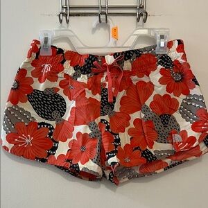 The North face red and black cactus flower quick dry shorts size small
